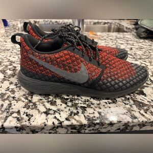 Nike Men’s Flyknit Black and Red Sneakers